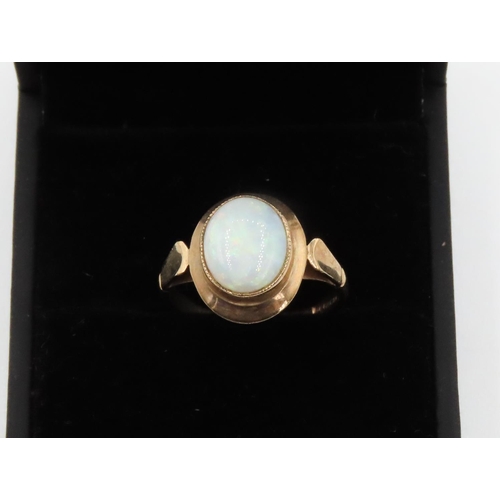 252 - Bezel Set Opal Single Stone Ring Set in 9 Carat Yellow Gold Ring Size N and a Half