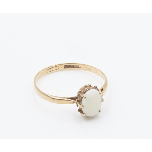 253 - Single Stone Opal Set Ring Mounted in 9 Carat Yellow Gold Ring Size M