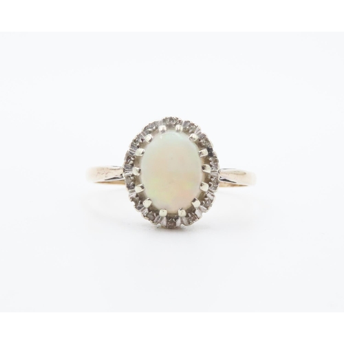 255 - Opal Centerstone Ring with Diamond Halo Set in 9 Carat Yellow Gold Ring Size R