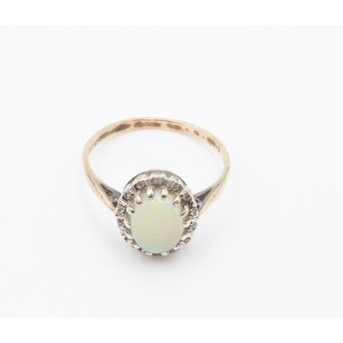 255 - Opal Centerstone Ring with Diamond Halo Set in 9 Carat Yellow Gold Ring Size R