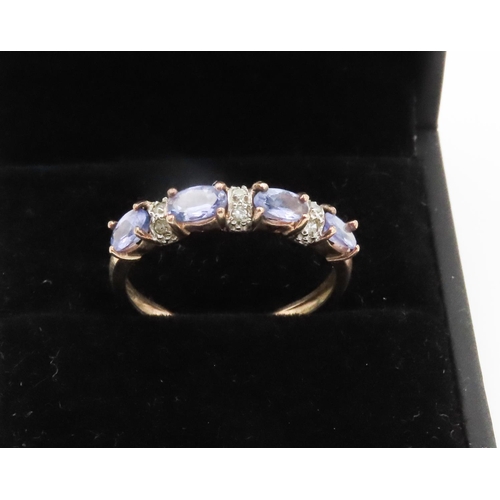 261 - Four Stone Tanzanite Ring Set in 9 Carat Yellow Gold with Further Diamonds set to Band Ring Size P a... 