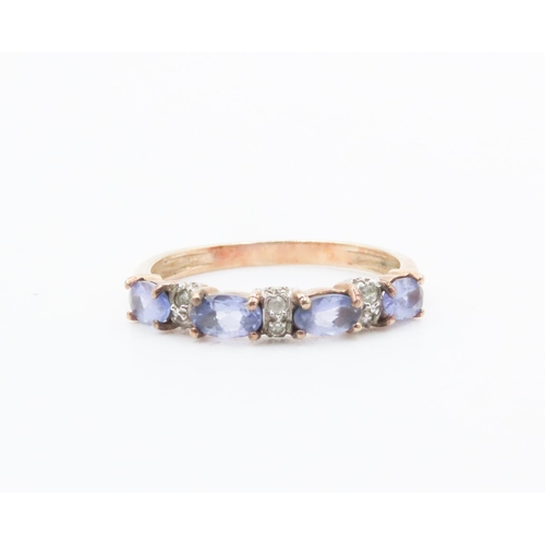 261 - Four Stone Tanzanite Ring Set in 9 Carat Yellow Gold with Further Diamonds set to Band Ring Size P a... 