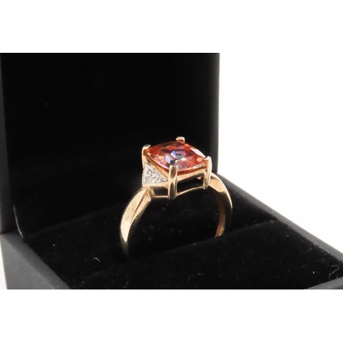 264 - Cushion Cut Colour Change Garnet Mounted in 9 Carat Yellow Gold with Further Diamonds Set to Shoulde... 