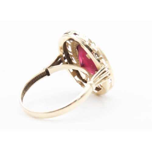 319 - Oval Cut Ruby Single Stone Geometric Design Set Ring Mounted in 14 Carat Yellow Gold Ring Size Q and... 