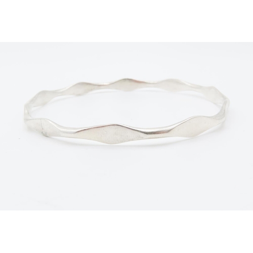 32 - Four Silver Bangles Includes One Cuff Bracelet