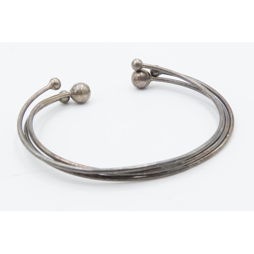 32 - Four Silver Bangles Includes One Cuff Bracelet