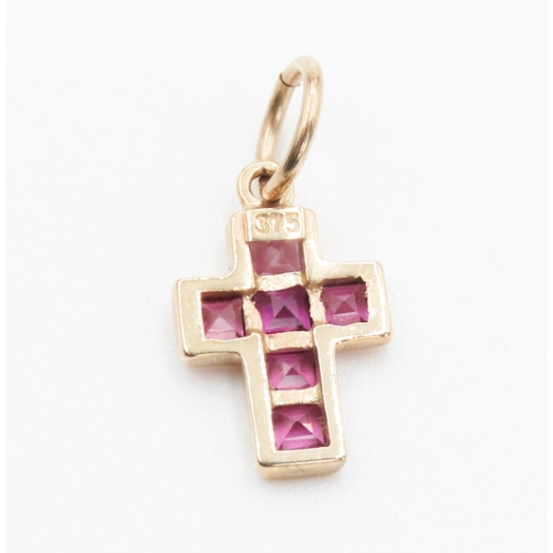 336 - Six Stone Ruby Set Cross Pendant Mounted in 9 Carat Yellow Gold 2cm High