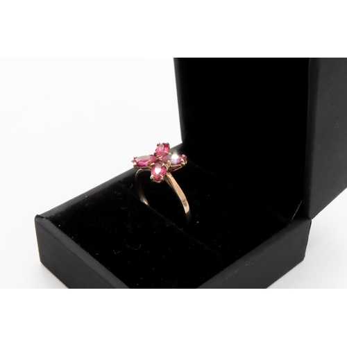 362 - Four Stone Ruby Petal Motif Ring Set in 9 Carat Yellow Gold Ring Size M and a Half