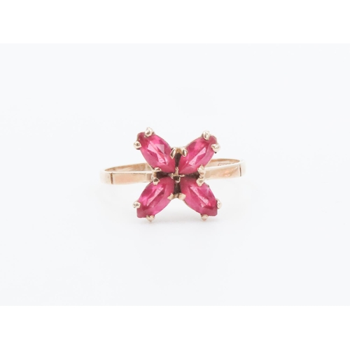 362 - Four Stone Ruby Petal Motif Ring Set in 9 Carat Yellow Gold Ring Size M and a Half