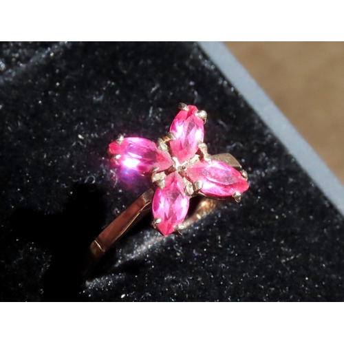 362 - Four Stone Ruby Petal Motif Ring Set in 9 Carat Yellow Gold Ring Size M and a Half