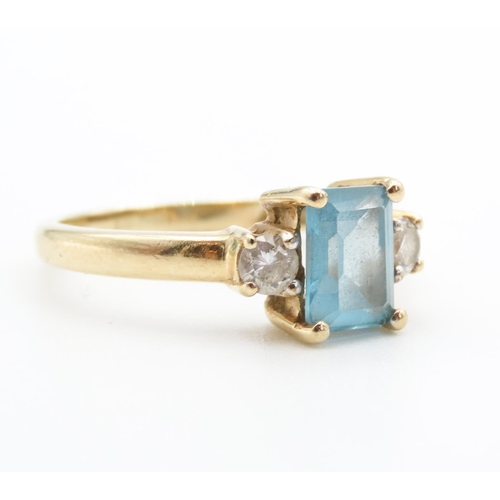 37 - Emerald Cut Alpine Blue Topaz Ring with Twin Gemstone Mounted to Shoulders Set in 9 Carat Yellow Gol... 