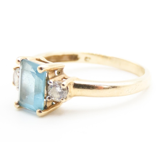 37 - Emerald Cut Alpine Blue Topaz Ring with Twin Gemstone Mounted to Shoulders Set in 9 Carat Yellow Gol... 