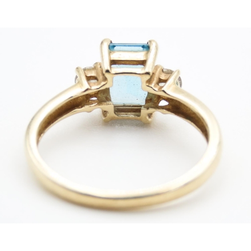 37 - Emerald Cut Alpine Blue Topaz Ring with Twin Gemstone Mounted to Shoulders Set in 9 Carat Yellow Gol... 