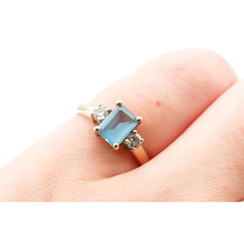 37 - Emerald Cut Alpine Blue Topaz Ring with Twin Gemstone Mounted to Shoulders Set in 9 Carat Yellow Gol... 