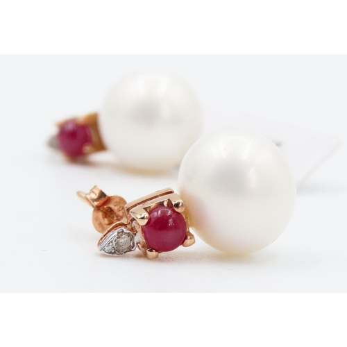 384 - Pair of Ruby and Diamond Set Pearl Earrings Mounted in 14 Carat Rose Gold Each 2cm high