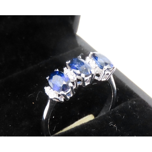 388 - Three Stone Sapphire Ring Basket Set in 18 Carat White Gold with Further Diamond Insets Ring Size O