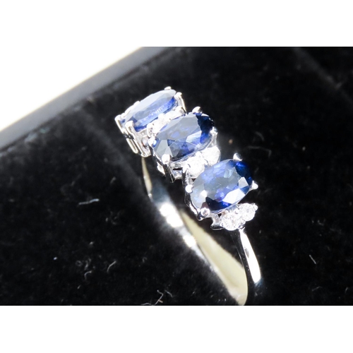 388 - Three Stone Sapphire Ring Basket Set in 18 Carat White Gold with Further Diamond Insets Ring Size O