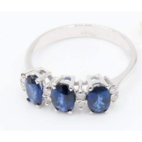 388 - Three Stone Sapphire Ring Basket Set in 18 Carat White Gold with Further Diamond Insets Ring Size O