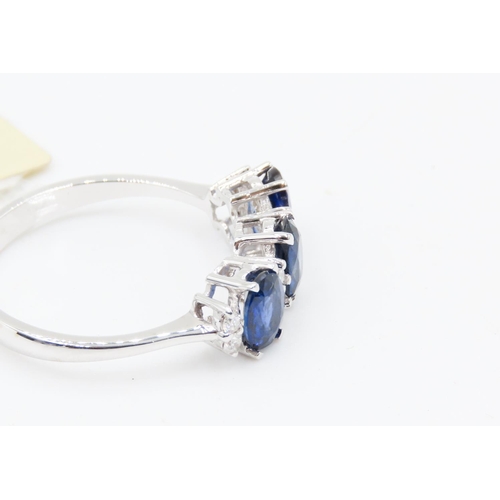 388 - Three Stone Sapphire Ring Basket Set in 18 Carat White Gold with Further Diamond Insets Ring Size O