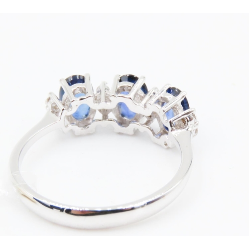 388 - Three Stone Sapphire Ring Basket Set in 18 Carat White Gold with Further Diamond Insets Ring Size O