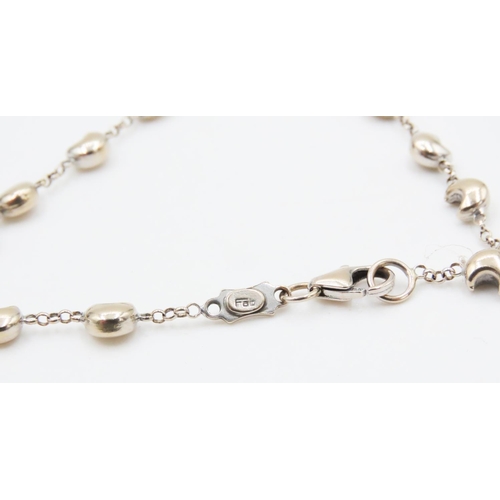 425 - 18 Carat White Gold Moon Motif Bracelet 18.5cm Long