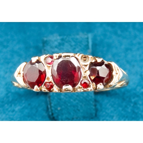 45 - Three Stone Red Garnet Ring Set in 9 Carat Yellow Gold with Further Garnet Decoration to Settings Ri... 