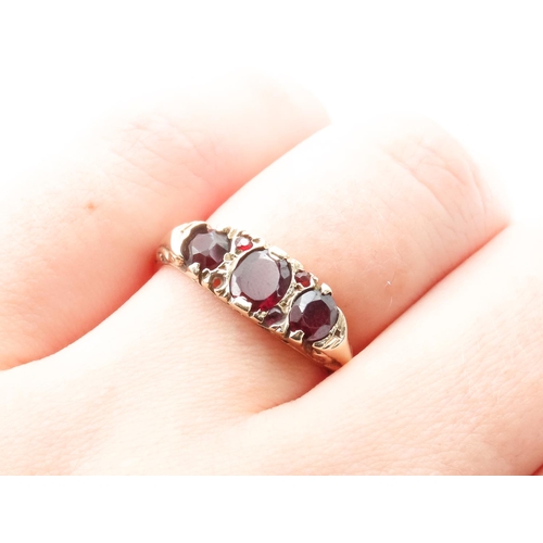 45 - Three Stone Red Garnet Ring Set in 9 Carat Yellow Gold with Further Garnet Decoration to Settings Ri... 