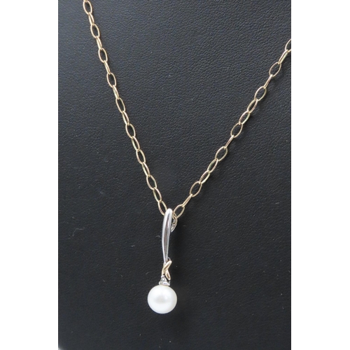 450 - 14 Carat Yellow and White Gold Pearl Set Pendant 3cm Drop Further Set on 9 Carat Yellow Gold Chain 4... 