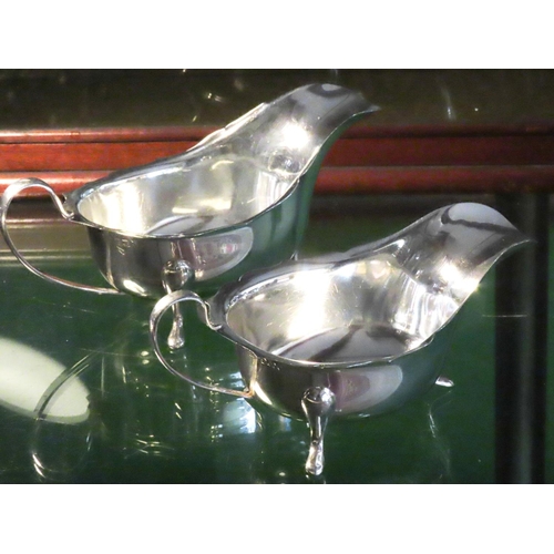 560 - Two Silver Sauce Boats Each with Shaped Supports Flying C Scrolled Handles Hallmarked