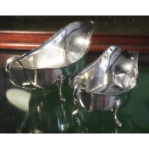 560 - Two Silver Sauce Boats Each with Shaped Supports Flying C Scrolled Handles Hallmarked