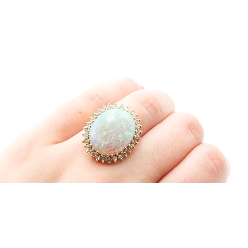 67 - Finely Set Opal Centre Stone Ring with Diamond Surround of High Colour and Scintillation Good Pin Fi... 