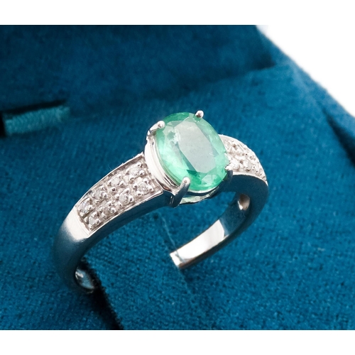 79 - Emerald Centre Stone  Four Claw Set Oval Cut Ring Set in 18 Carat White Gold with Further Diamonds S... 