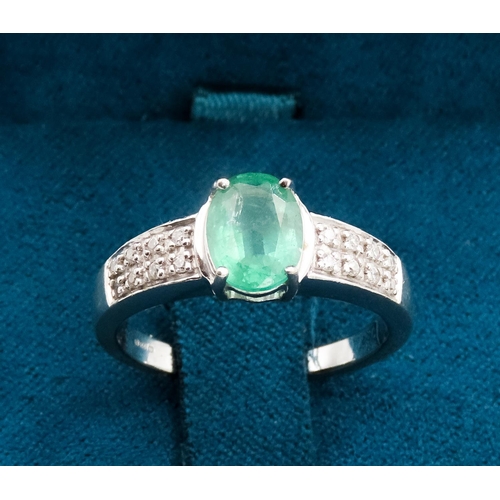 79 - Emerald Centre Stone  Four Claw Set Oval Cut Ring Set in 18 Carat White Gold with Further Diamonds S... 