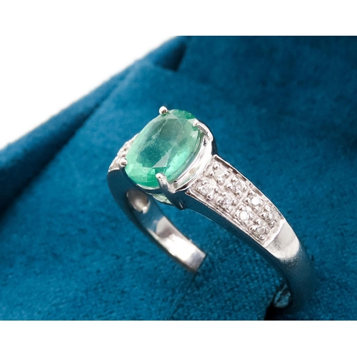 79 - Emerald Centre Stone  Four Claw Set Oval Cut Ring Set in 18 Carat White Gold with Further Diamonds S... 