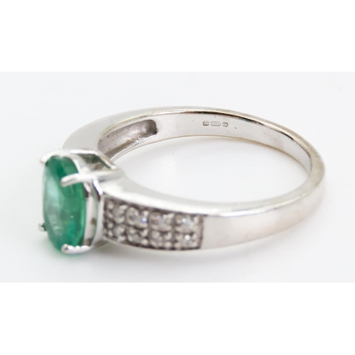 79 - Emerald Centre Stone  Four Claw Set Oval Cut Ring Set in 18 Carat White Gold with Further Diamonds S... 