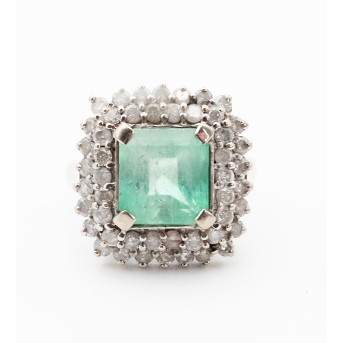 84 - Emerald Centre Stone Ring with Diamond Set Twin  Halo Surround Mounted in 18 Carat White Gold Ring S... 