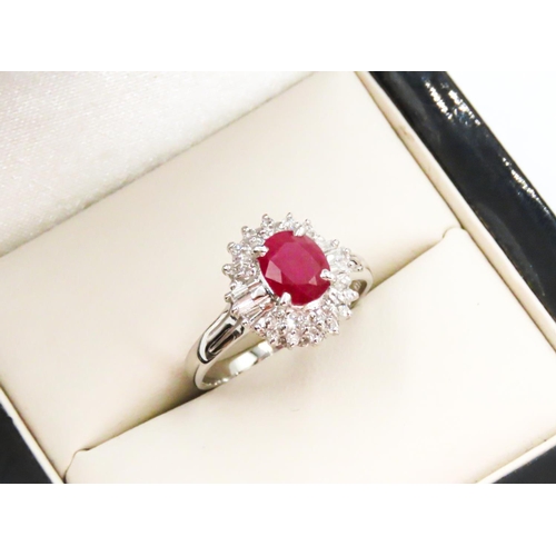 12 - Ruby Set Ring with Further Baguette and Round Cut Diamond Surround Set in Platinum Ring Size K