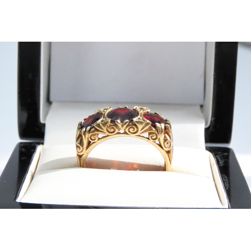 30 - Three Stone Garnet Ring Finely Detailed Set in 9 Carat Yellow Gold Ring Size P