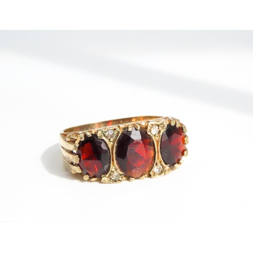 30 - Three Stone Garnet Ring Finely Detailed Set in 9 Carat Yellow Gold Ring Size P