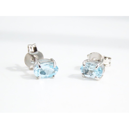 35 - Pair of Oval Cut Aquamarine Set Ladies Earrings Mounted in 9 Carat White Gold 5mm High