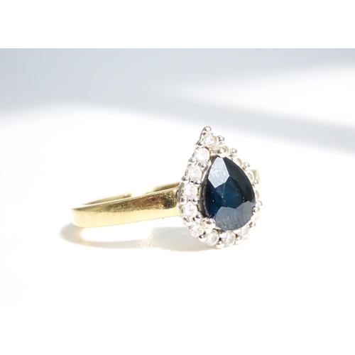 45 - Pear Cut Sapphire Ring Set in 18 Carat Yellow Gold with Diamond Halo Surround Ring Size N and a Half