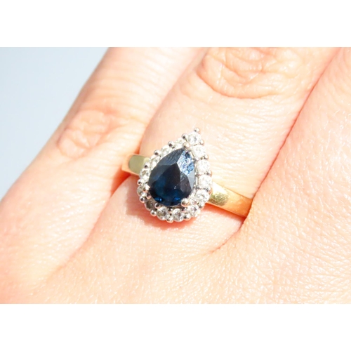 45 - Pear Cut Sapphire Ring Set in 18 Carat Yellow Gold with Diamond Halo Surround Ring Size N and a Half