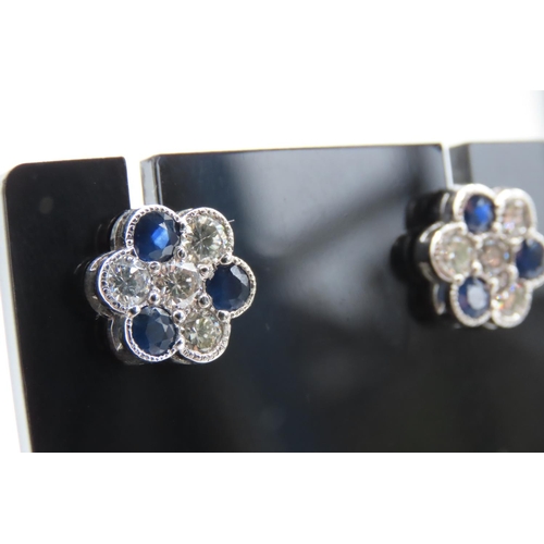 61 - Pair of Sapphire and Diamond Set Daisy Motif Earrings Set in Platinum Total Sapphire Carat Weight 2 ... 