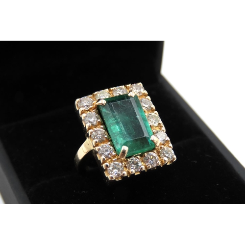 66 - Emerald and Fourteen Diamond Set Ladies Ring Mounted in 18 Carat Yellow Gold Total Emerald Carat Wei... 