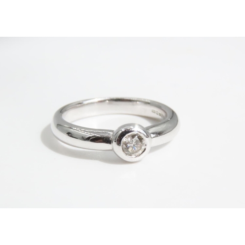 68 - Diamond Solitaire Ring Rub Over Setting Mounted on 9 Carat White Gold Band Ring Size N and A Half