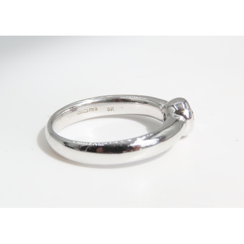 68 - Diamond Solitaire Ring Rub Over Setting Mounted on 9 Carat White Gold Band Ring Size N and A Half