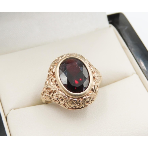 724 - Attractively Detailed Bezel Set Red Garnet Single Stone Ring Mounted in 9 Carat Yellow Gold Ring Siz... 