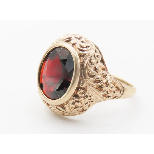 724 - Attractively Detailed Bezel Set Red Garnet Single Stone Ring Mounted in 9 Carat Yellow Gold Ring Siz... 