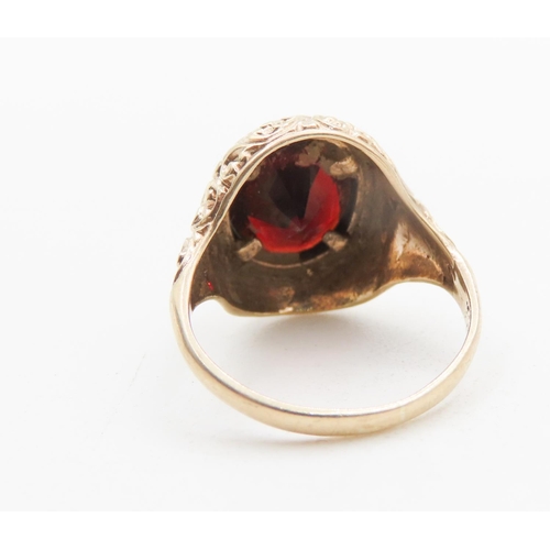 724 - Attractively Detailed Bezel Set Red Garnet Single Stone Ring Mounted in 9 Carat Yellow Gold Ring Siz... 