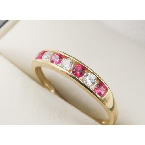 725 - Pink and Clear Gemstone Set Half Eternity Ring Mounted in 9 Carat Yellow Gold Ring Size M